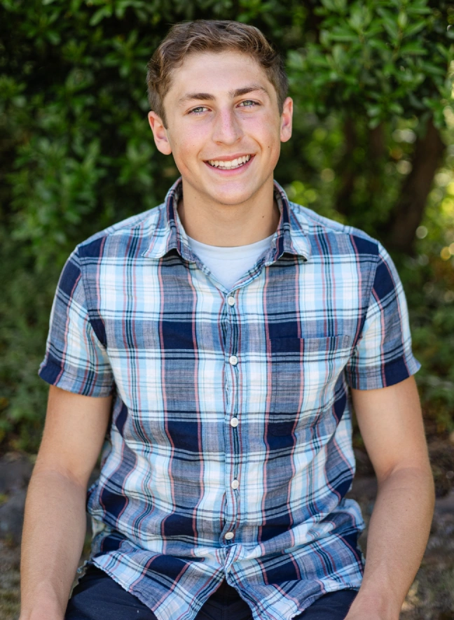 A teenage boy smiling